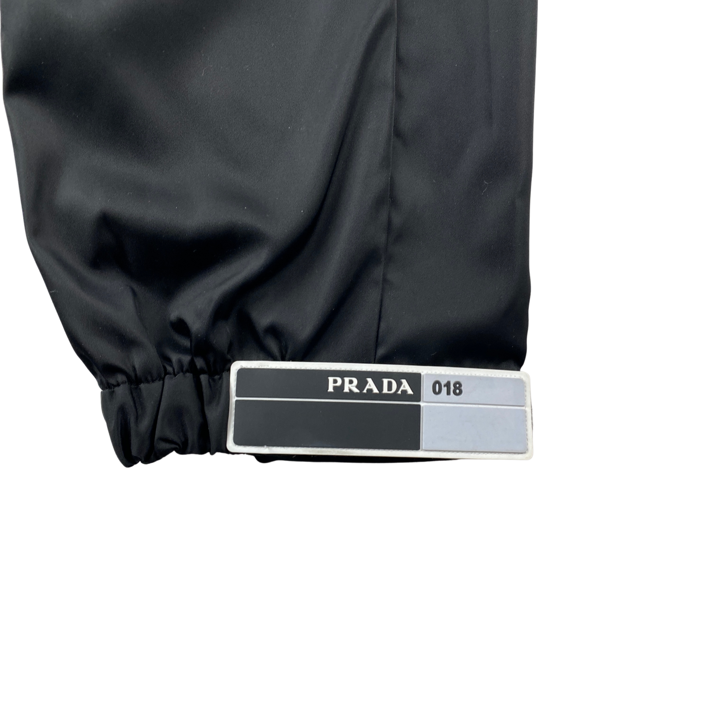 Prada rubber tag track pants sales
